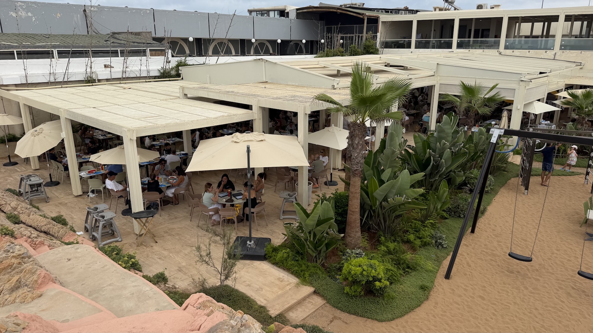 The dining terrace at sunset, facing the bay